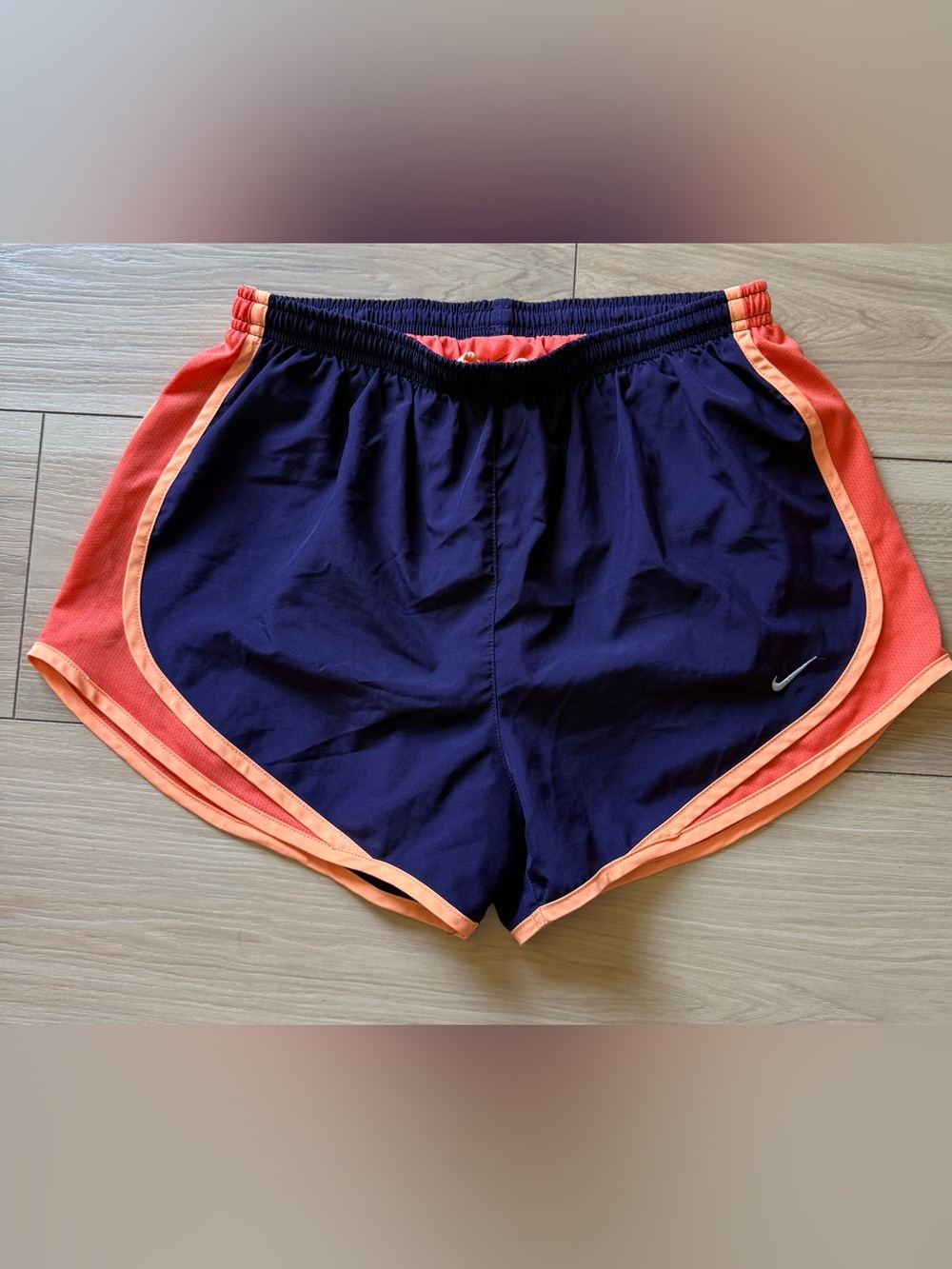 Nike Women's Dark Blue Athletic Shorts with Coral Trim